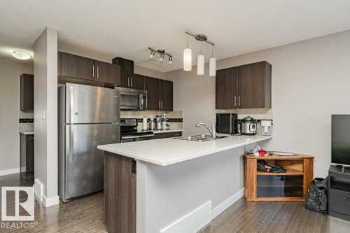 20 2004 Trumpeter Way, Edmonton, AB - Indoor Photo Showing Kitchen With Stainless Steel Kitchen