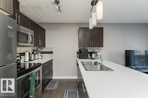 20 2004 Trumpeter Way, Edmonton, AB - Indoor Photo Showing Kitchen With Double Sink