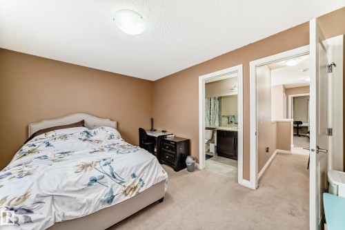 This room features neutral-toned walls and carpeted flooring - 23 445 Brintnell Boulevard Nw, Edmonton, AB - Indoor Photo Showing Bedroom