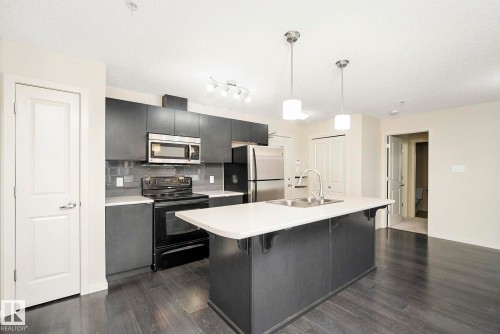 112 340 Windermere Road, Edmonton, AB - Indoor Photo Showing Kitchen With Stainless Steel Kitchen With Double Sink With Upgraded Kitchen