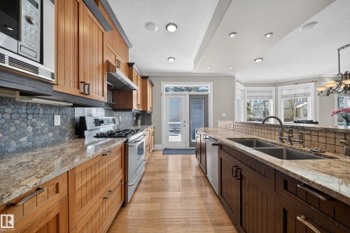 27 Kingdom Place, Leduc, AB - Indoor Photo Showing Kitchen With Double Sink With Upgraded Kitchen
