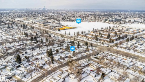 Aerial view of the neighborhood showcasing tree-lined streets and houses with snow-covered roofs - 6411 149 Avenue Nw, Edmonton, AB - Outdoor With View