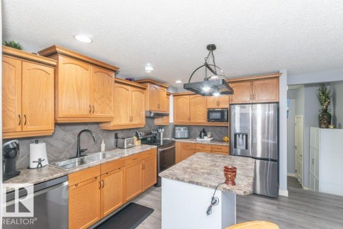 41 Pointe Masson, Beaumont, AB - Indoor Photo Showing Kitchen With Double Sink