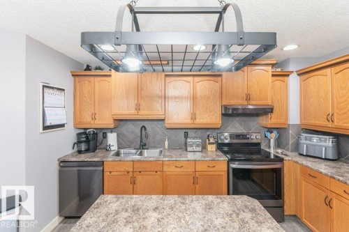 41 Pointe Masson, Beaumont, AB - Indoor Photo Showing Kitchen With Double Sink