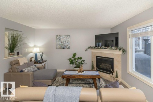 41 Pointe Masson, Beaumont, AB - Indoor Photo Showing Living Room With Fireplace