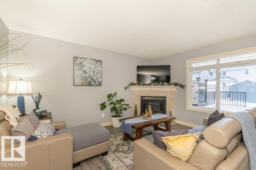 41 Pointe Masson, Beaumont, AB - Indoor Photo Showing Living Room With Fireplace