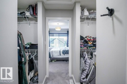 This property features ample storage solutions, including two visible closet spaces with wire shelving - 266 Charlesworth Drive, Edmonton, AB - Indoor