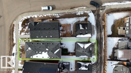 Aerial view of the property, showcasing its position on a corner lot with a sidewalk - 266 Charlesworth Drive, Edmonton, AB - 