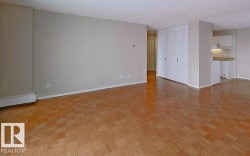 Empty room featuring parquet flooring and baseboards - 