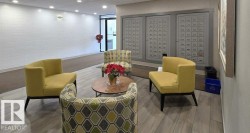 Living area with recessed lighting and mail area - 