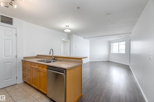 306 6921 199 Street, Edmonton, AB - Indoor Photo Showing Kitchen With Double Sink