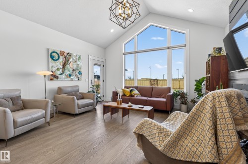 Spacious living area featuring large windows, vaulted ceilings, and light-toned flooring - 45 Evermore Crescent, St. Albert, AB - Indoor Photo Showing Living Room
