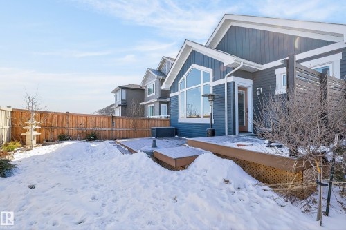 The property features an extensive backyard with a wooden fence and a multi-level deck - 45 Evermore Crescent, St. Albert, AB - Outdoor