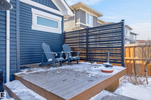 The property features a wooden deck with slatted privacy screening and a fence - 45 Evermore Crescent, St. Albert, AB - Outdoor
