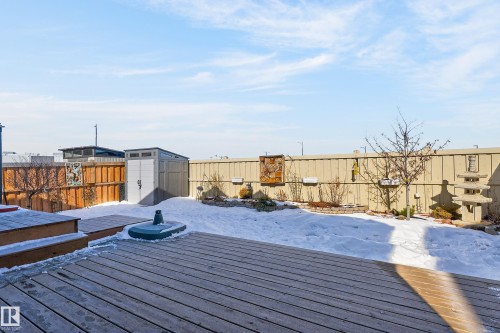 The property features a spacious backyard with a wooden deck, a storage shed, and a fenced perimeter - 45 Evermore Crescent, St. Albert, AB - Outdoor