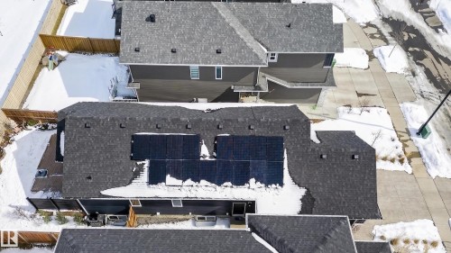 The property features a dark-colored shingle roof with integrated solar panels - 45 Evermore Crescent, St. Albert, AB - Outdoor