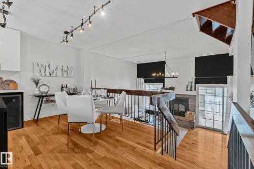 Bright dining area featuring hardwood flooring and track lighting - 17082 67 Avenue Nw, Edmonton, AB - Indoor