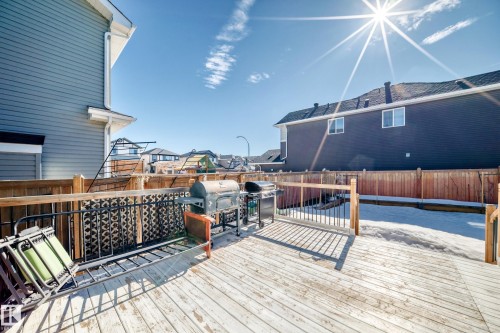 Spacious wooden deck with a detailed metal railing, surrounded by a wooden fence, offering an inviting outdoor area - 22407 99 Avenue, Edmonton, AB - Outdoor With Deck Patio Veranda With Exterior