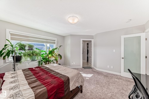 This room features a spacious window with blinds and a carpeted floor - 22407 99 Avenue, Edmonton, AB - Indoor Photo Showing Bedroom