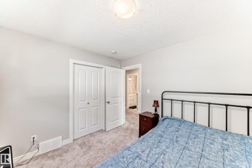 Bedroom featuring light-colored walls and carpeted flooring - 22407 99 Avenue, Edmonton, AB - Indoor Photo Showing Bedroom