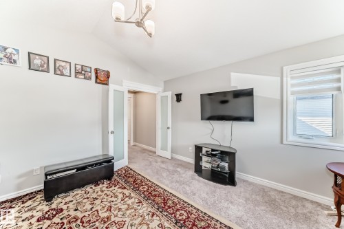 This room features neutral-toned walls, a window with blinds, and carpeted flooring - 22407 99 Avenue, Edmonton, AB - Indoor Photo Showing Other Room