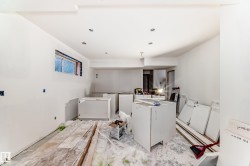 The property presents an interior space with white walls and recessed lighting - 