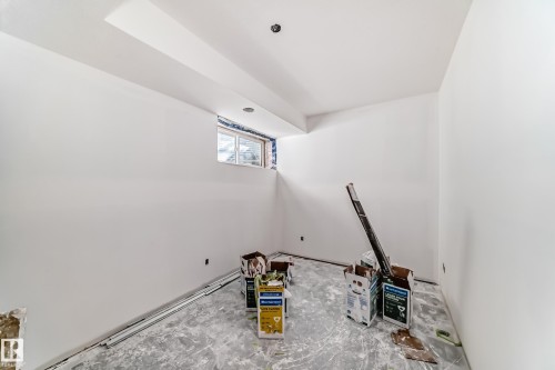 The property features an unfinished interior space with white walls, a window, and a recessed light fixture in the ceiling - 22407 99 Avenue, Edmonton, AB - Indoor Photo Showing Other Room