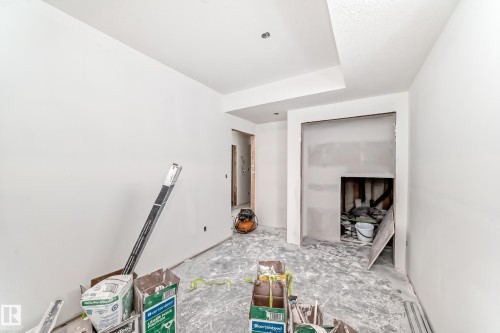 The property features a room with freshly painted white walls and a ceiling with a subtle texture - 22407 99 Avenue, Edmonton, AB - Indoor Photo Showing Other Room