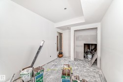 The property features a room with freshly painted white walls and a ceiling with a subtle texture - 