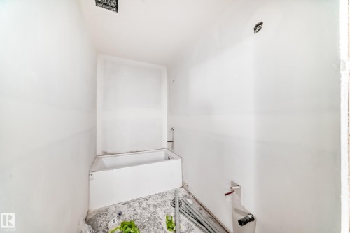 Bathroom with a white bathtub and white walls, ready for customization - 22407 99 Avenue, Edmonton, AB - Indoor