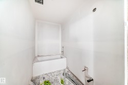 Bathroom with a white bathtub and white walls, ready for customization - 