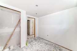 Interior space with white walls and an untextured ceiling - 
