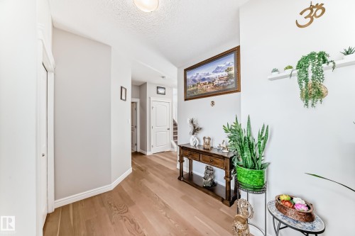 Inviting hallway with light wood flooring and light-colored walls - 22407 99 Avenue, Edmonton, AB - Indoor Photo Showing Other Room