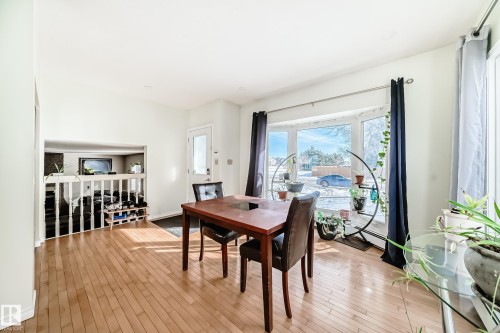 The property features a bright interior with light-colored walls and wood flooring - 16232 100 Street, Edmonton, AB - Indoor Photo Showing Dining Room