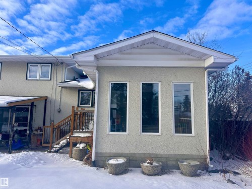 The property features an exterior with stucco siding and a roof with white soffit and fascia - 9915 95 Street, Westlock, AB - Outdoor