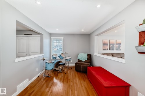 This room features hardwood floors and recessed lighting - 6303 2 Avenue, Edmonton, AB - Indoor Photo Showing Other Room
