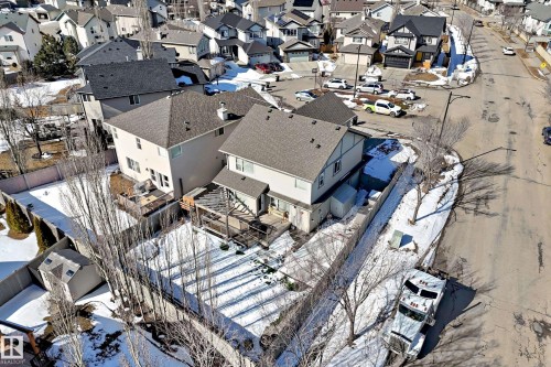 The property features an extensive backyard with a shed, a wooden deck, and a fenced perimeter - 6303 2 Avenue, Edmonton, AB - Outdoor