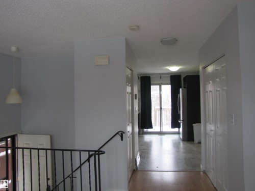The property features light-colored walls and a blend of light wood and tiled flooring - 3617 43A Avenue, Edmonton, AB - Indoor Photo Showing Other Room