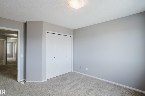 Room featuring light grey walls, white baseboards, and carpeted floors - 14007 164 Avenue, Edmonton, AB - Indoor Photo Showing Other Room