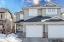 The property features a light grey exterior with white window frames and a dark grey roof - 14007 164 Avenue, Edmonton, AB  - Outdoor With Facade 