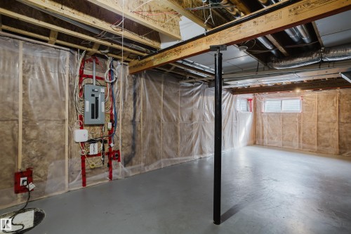The property features an unfinished basement with exposed wooden beams, insulation, and a concrete floor - 14007 164 Avenue, Edmonton, AB - Indoor Photo Showing Basement