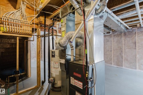 This property features a water heater and a Goodman furnace - 14007 164 Avenue, Edmonton, AB - Indoor Photo Showing Basement