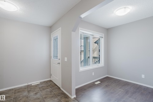 This inviting space features light grey walls and overhead lighting and a den/ office - 14007 164 Avenue, Edmonton, AB - Indoor Photo Showing Other Room