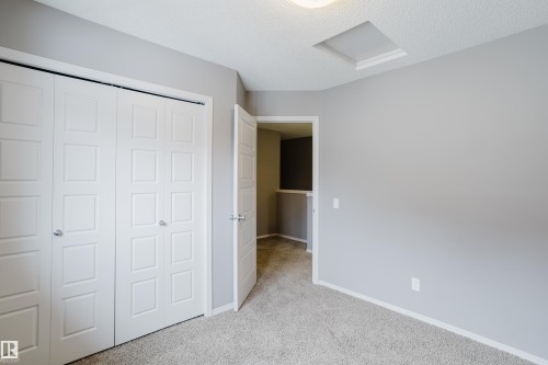This room features light grey walls and light colored carpet flooring - 14009 164 Avenue, Edmonton, AB - Indoor