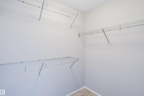 The property features a closet with wire shelving and hanging rods providing storage solutions - 14009 164 Avenue, Edmonton, AB - Indoor With Storage