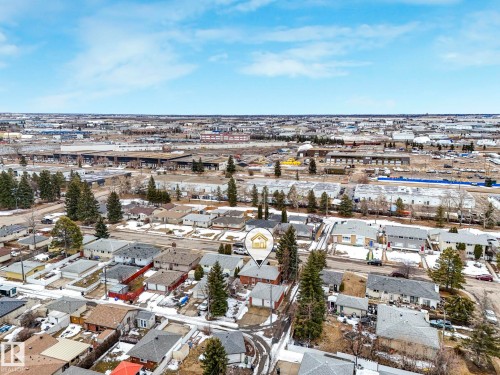 Aerial view showcasing the residential neighborhood with a variety of homes, featuring a mix of evergreen trees and bare deciduous trees - 5904 84 Avenue, Edmonton, AB - Outdoor With View