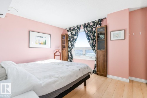 Bedroom featuring light wood-style flooring and baseboards - 1207 12303 Jasper Avenue, Edmonton, AB - Indoor Photo Showing Bedroom