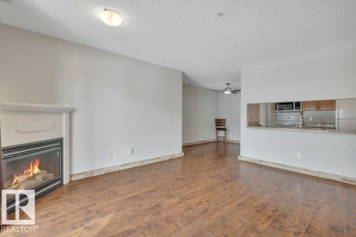 242 16311 95 Street, Edmonton, AB - Indoor Photo Showing Living Room With Fireplace