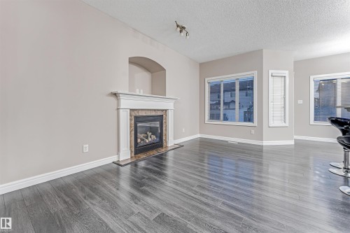 2929 16A Avenue, Edmonton, AB - Indoor Photo Showing Living Room With Fireplace