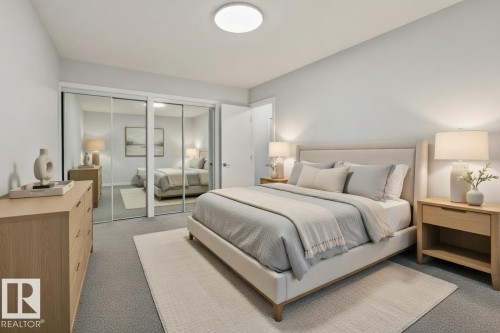 This room features plush grey carpeting, a large mirrored closet, and a neutral color palette - 8620 38A Avenue, Edmonton, AB - Indoor Photo Showing Bedroom